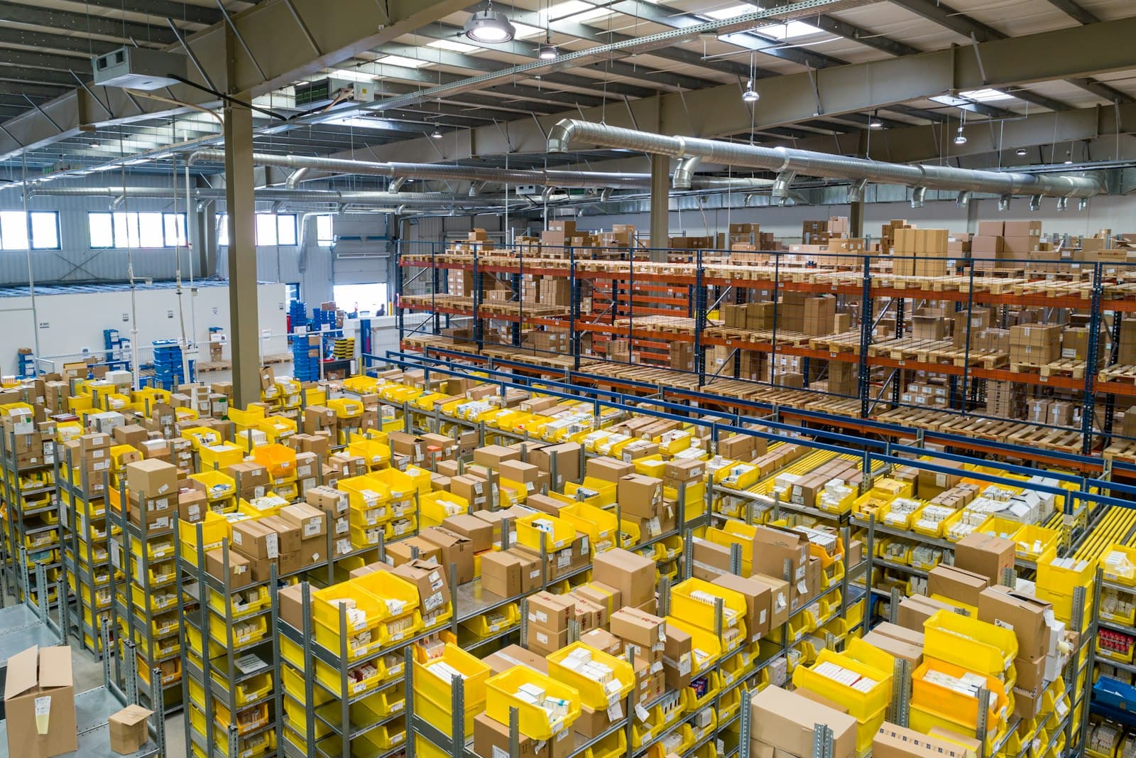 Industrial warehouse aisles with stocked shelving