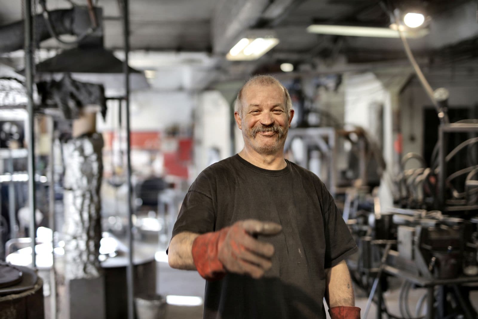 Experienced tradesperson in a fabrication workshop